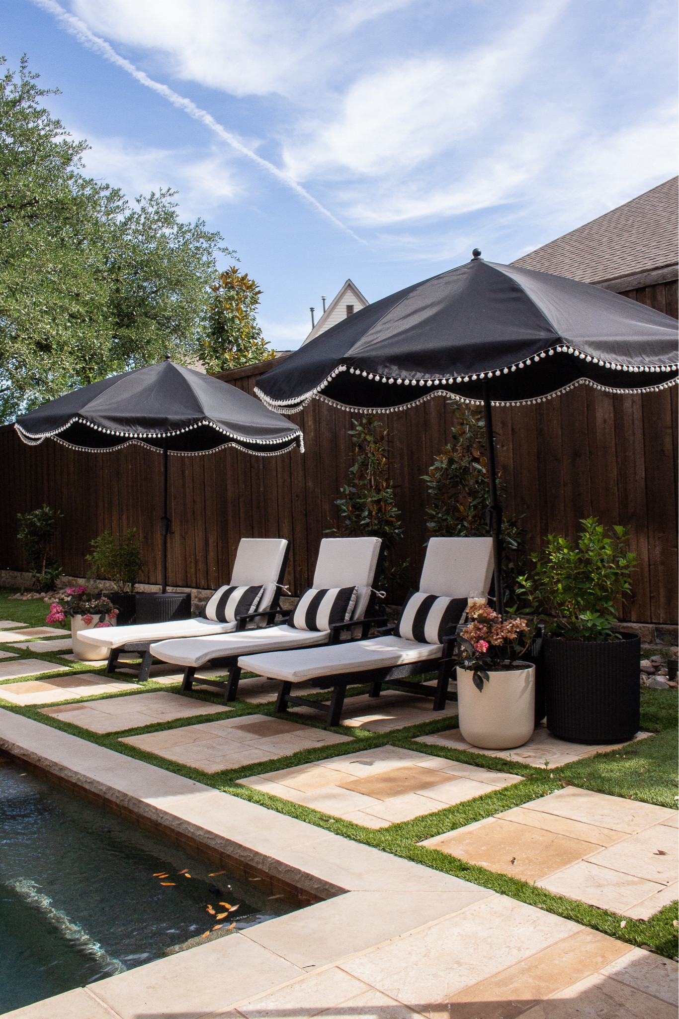 A classic poolside setup with neutral outdoor chaise loungers, black patio umbrellas, and timeless outdoor decor. Clean lines and simple styling make this backyard feel polished and resort-inspired. Everything is linked here.

#LTKHome #LTKdayinmylife #LTKSeasonal