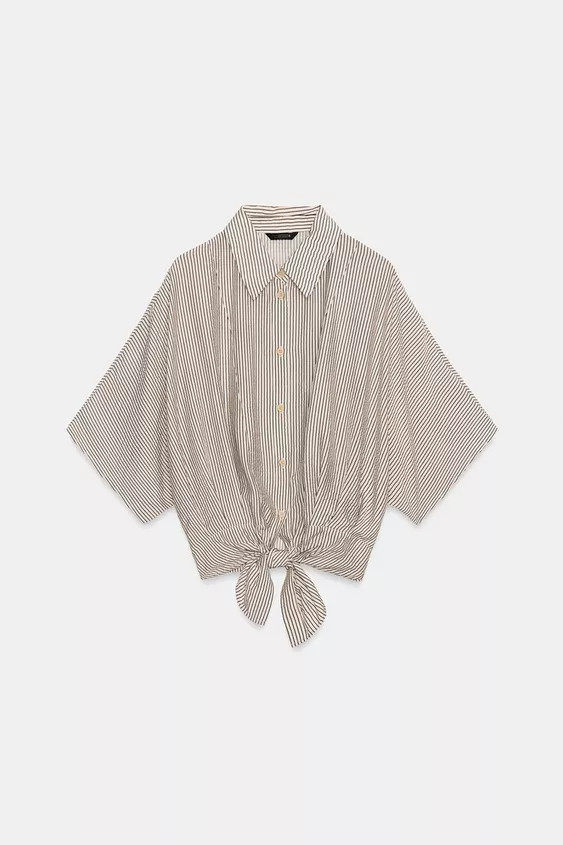 Lapel collar shirt with short sleeves. Front knot detail at hem. Front button closure. | Zara US