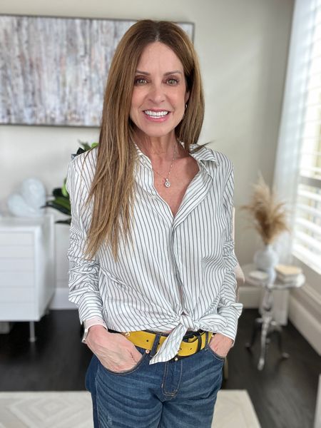This is a MUST HAVE top for year round wear. It’s a classic striped button down shirt with shirring down the sleeves so you can customize the look. Runs tts. I’m wearing a size small and paired with the slim boyfriend jeans and multi color leather and suede belt.

#cabi #cabiclothing #classicstyle

#LTKFind #LTKstyletip #LTKworkwear