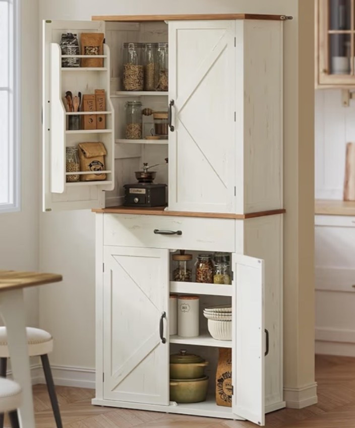 Tall farmhouse pantry cabinet with that warm rustic kitchen feel that makes a space look instantly more organized and inviting. 🌾🪿🍎 Perfect for a kitchen, dining room, coffee bar setup, pantry wall, entryway, or living space when you want extra storage that still feels decorative and timeless. The barn doors, rustic white finish, drawer, tray shelf, and adjustable shelving give it that cozy countryside look while keeping everyday essentials tucked away. 

Add this cabinet if your home needs a beautiful storage piece with classic farmhouse character. 🍅🌿🐄

#LTKHome #LTKOver40 #LTKfoodie