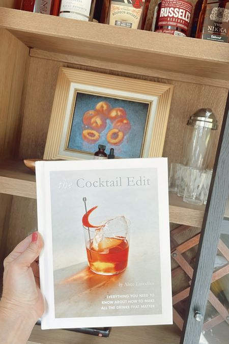 Added this cocktail book to my bar cabinet! You can find the hardcover copy on sale at Amazon for under $10! 🙌🏻🍸 #book #displaybook #recipebook #hardcoverbook #ltkhome #amazon 