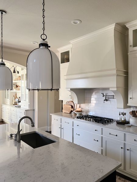 Our milk glass and bronze kitchen island pendants



#LTKhome