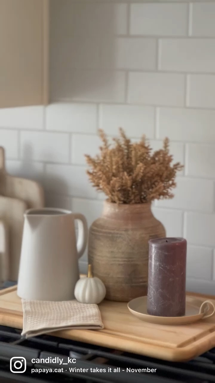 Have you found the perfect piece of decor for fall that your loving? I needed to have this pillar candle holder to add the perfect touch of ‘vintage fall’ to my decor this year and I am in love. 🕯 

 🤎follow me @candidly_kc for more home inspo  🍂

.
.
.
.
.
#Fall #Fallvibes #fallmood #fallbucketlist #fallalready #fallfavorites #fallisintheair #fallmood #falllove #fallismyfavorite #fallismyfavoriteseason #fallismyfavoritecolor #fallish #pillarcandles #fallismyseason #threshold #Ilovefallmostofall #targetfinds #target #ilovefalltime #kitchendecor #fallkitchen #fallharvest #cozyfall #autumnvibes #autumnvibe #autumnmood #autumnvibes #autumniscoming #autumnishere #autumniscoming #fallmoments
Vase, dried florals, pitcher, ceramic pumpkins, candle, wood tray, wood cutting board, tile

#LTKunder100 #LTKhome #LTKSeasonal