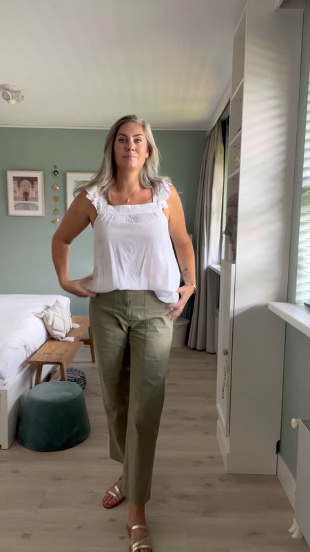 30 days of summer outfits. A tall white cotton ruffle top from LTS paired with tall khaki cargo trousers from Marks and Spencers. H&M gold strappy leather sandals, round sunglasses. Nude underwear. Michael Kors Bradshaw smartwatch  

#LTKstyletip #LTKeurope #LTKSeasonal