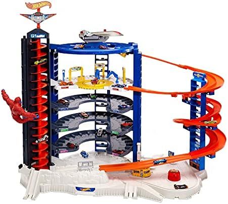 Hot Wheels Track Set with 4 1:64 Scale Toy Cars, Over 3-Feet Tall Garage with Motorized Gorilla, ... | Amazon (US)