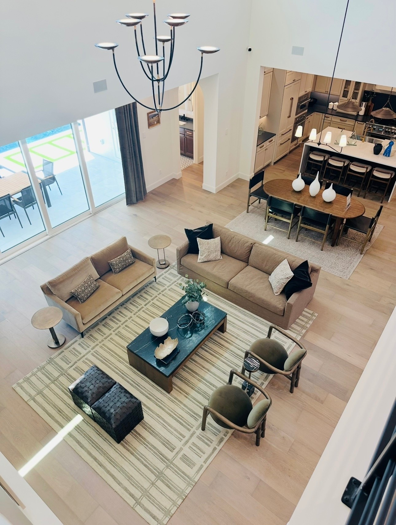 The key to designing an open concept Living Room is having a great rug as the foundation.  This neutral color rug  brings the entire space together and works well with multiple design styles.

#LTKStyleTip #LTKHome