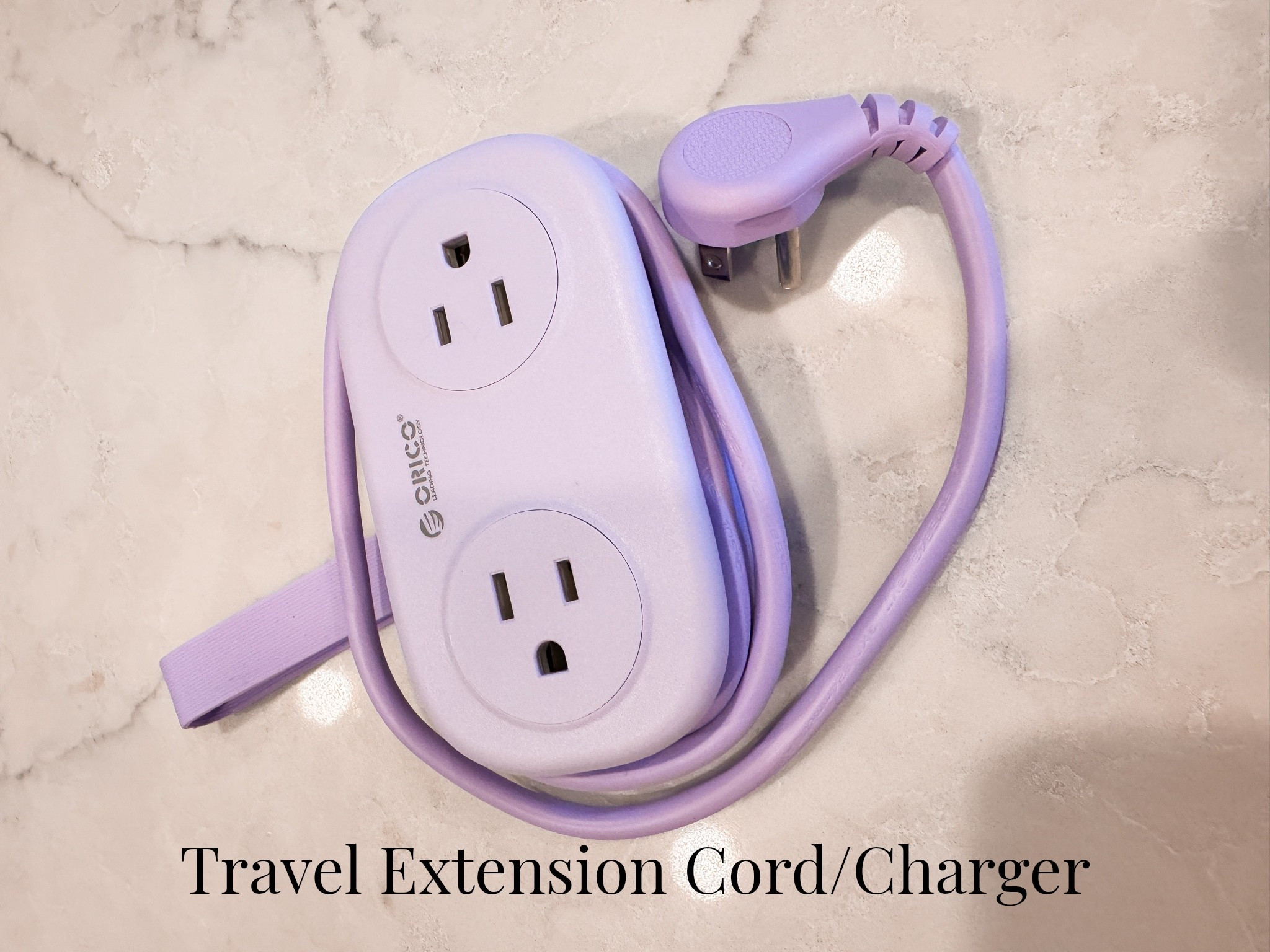 You can never have too many outlets when you travel. I love that this has plug and USB options!  And a silicone band to secure when packing.