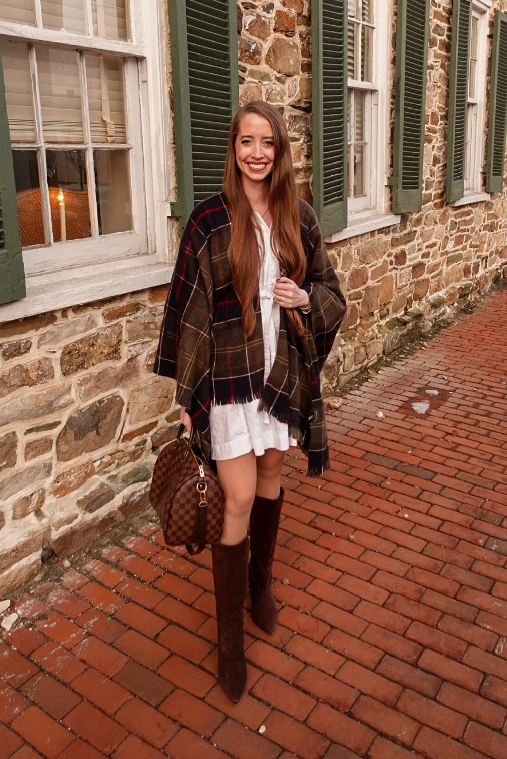 Spring transitional outfit 
.
Plaid cape
White shirt dress
Brown knee high boots 

#LTKSeasonal