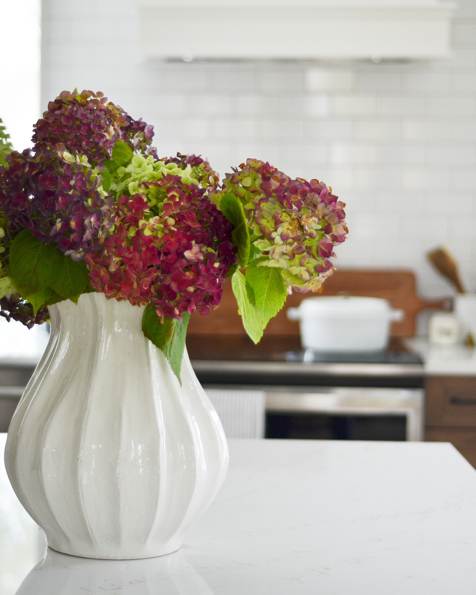 An item we love to use in our photoshoots as well as in our own homes is a statement vase. We love the impact of a large, sculptural vase on a kitchen counter or as a centerpiece on a dining room or entry table. We found three oversized vases at three different price points, including this beautiful pleated vase we used in a recent photoshoot. 

 #LTKHome