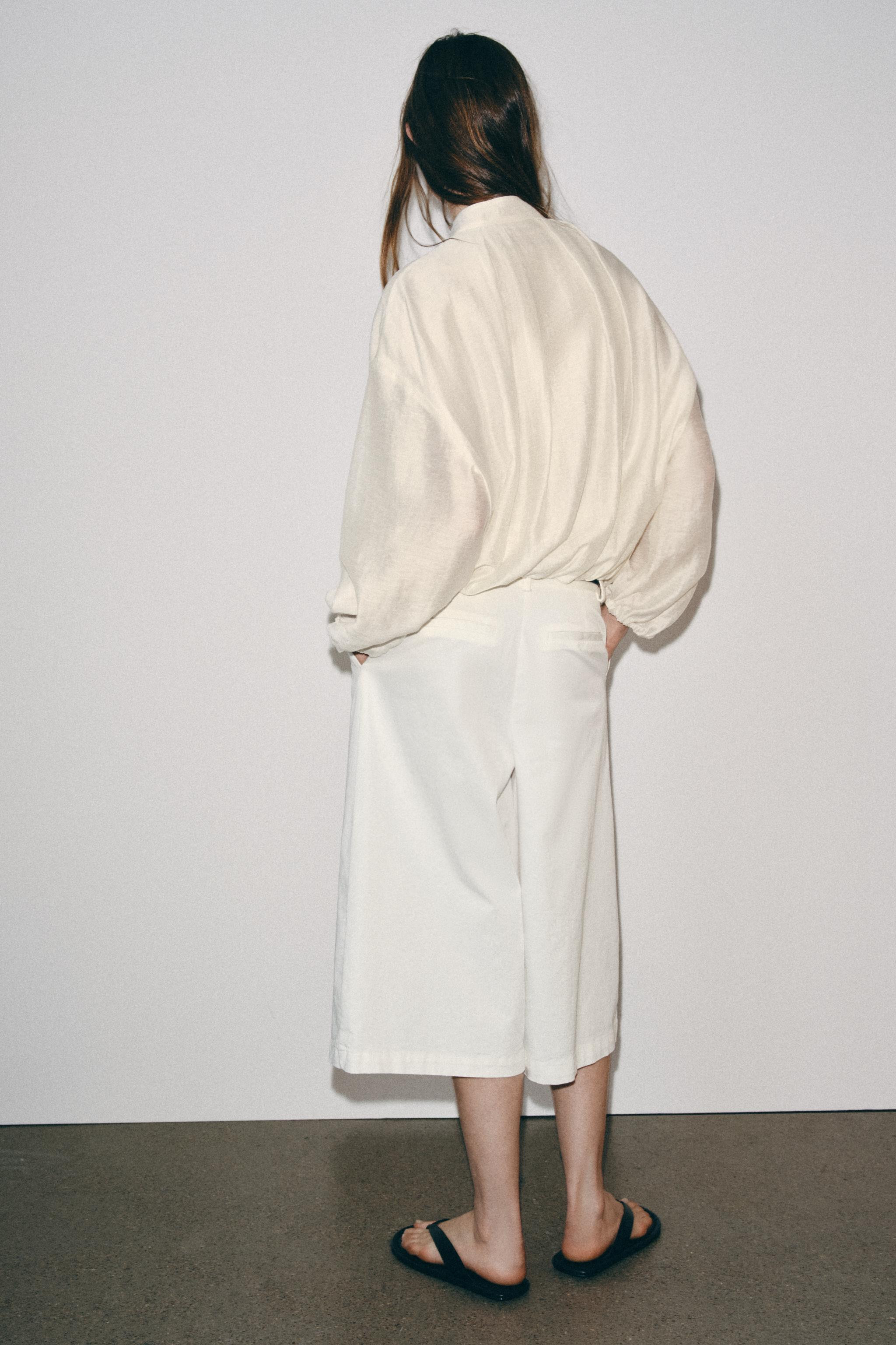 Long-sleeve jacket with a mock neck. Features concealed side seam pockets, elasticized finishes, ... | Zara US