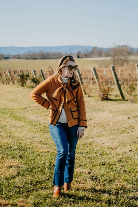 We're en route home from a cozy winter getaway in North Carolina, where we were greeted with true winter temperatures. This boiled merino wool with its own bow scarf was my way to stay polished and warm while facing the wind and chilly air out in a new-to-me wine country. The scalloped black embroidery is the most darling detail, and I loved pairing it with a different look than I have previously — dark jeans, cognac booties, and a thick ivory knit turtleneck. @etceteranyc #etcetera, #etceteranyc #etceterawinter2023 

#LTKSeasonal #LTKsalealert #LTKHoliday