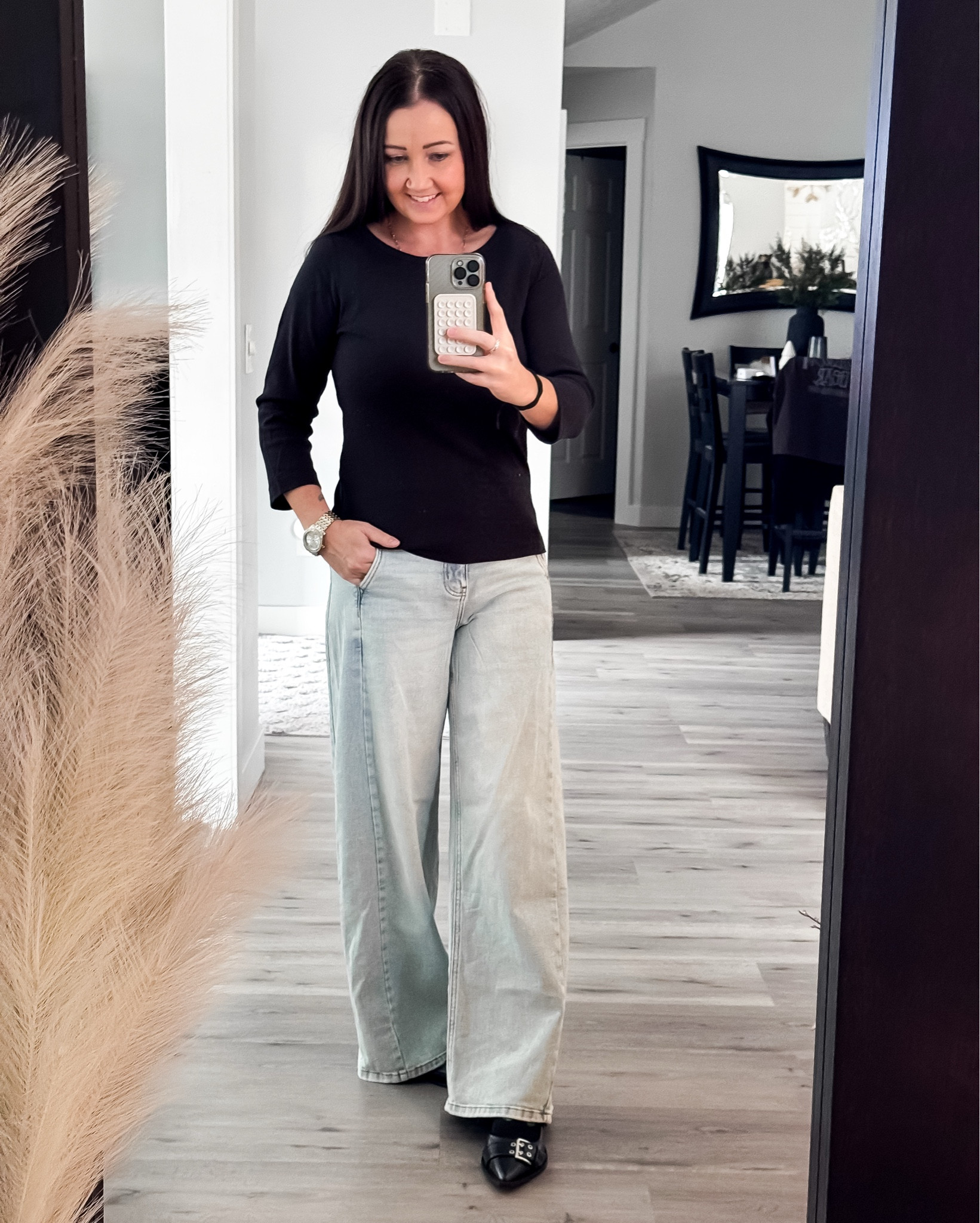 OOTD perfection for every casual-chic day!
This look is giving effortless style with a sleek fitted black top that pairs with anything and instantly pulls an outfit together. I’m obsessed with how it balances out these light-wash wide-leg jeans — relaxed, comfy, and so flattering. And can we take a moment for these pointed-toe buckle flats?! They’re the perfect mix of polished + edgy with that bold buckle detail. So comfy for all-day wear but still totally elevated.

This whole look is the perfect blend of modern, minimal, and wearable. Whether you’re heading to lunch, running errands, or grabbing a quick coffee, it’s one of those throw-on outfits that looks styled without even trying.

wide leg jeans • black long sleeve top • pointed toe flats • buckle flats • minimalist outfits • casual chic outfit • everyday basics for women • comfortable jeans outfit • trending flats 2025 • capsule wardrobe essentials • neutral outfit ideas • comfy polished outfit • elevated basics • modern casual style • cute outfit ideas for women • winter outfit ideas • winter outfit basics, gift for her • OOTD

#LTKFindsUnder100 #LTKGiftGuide #LTKootd