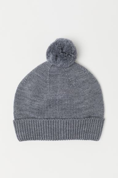 PREMIUM QUALITY. Knit hat in soft merino wool with a pompom at top. Ribbed, foldover cuff. | H&M (US + CA)