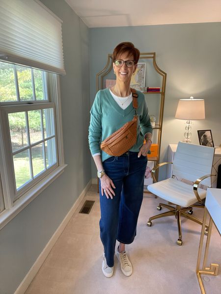Jeans and white tee four ways.
Look number four is the casual look.
White tee, jeans, green v-neck sweater and a belt bag

Over 50 fashion, tall fashion, workwear, everyday, timeless, Classic Outfits

Hi I’m Suzanne from A Tall Drink of Style - I am 6’1”. I have a 36” inseam. I wear a medium in most tops, an 8 or a 10 in most bottoms, an 8 in most dresses, and a size 9 shoe. 

fashion for women over 50, tall fashion, smart casual, work outfit, workwear, timeless classic outfits, timeless classic style, classic fashion, jeans, date night outfit, dress, spring outfit

#LTKover40 #LTKfindsunder100 #LTKstyletip