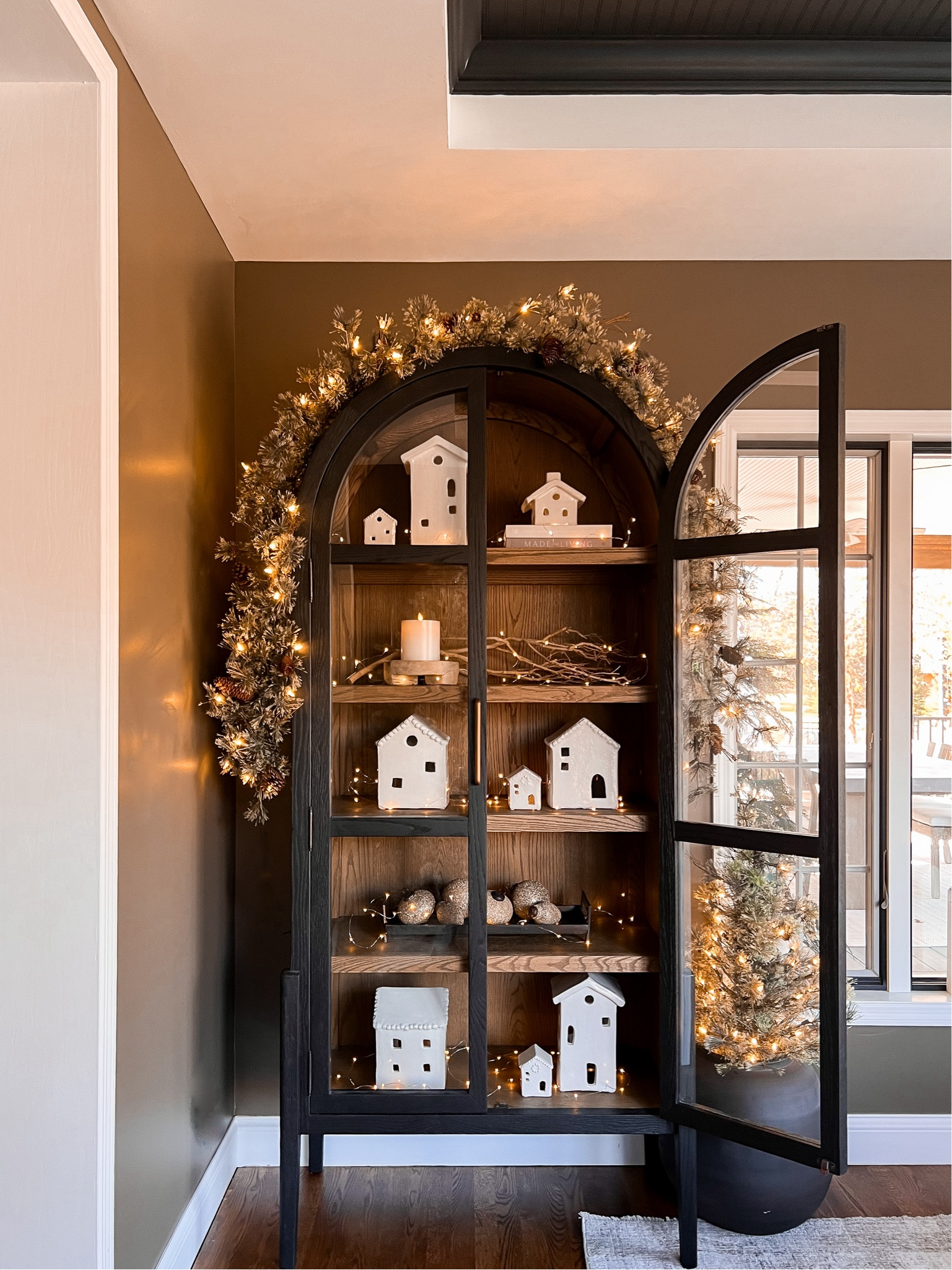 My favorite houses in my favorite cabinet 

#LTKHome #LTKStyleTip #LTKHoliday