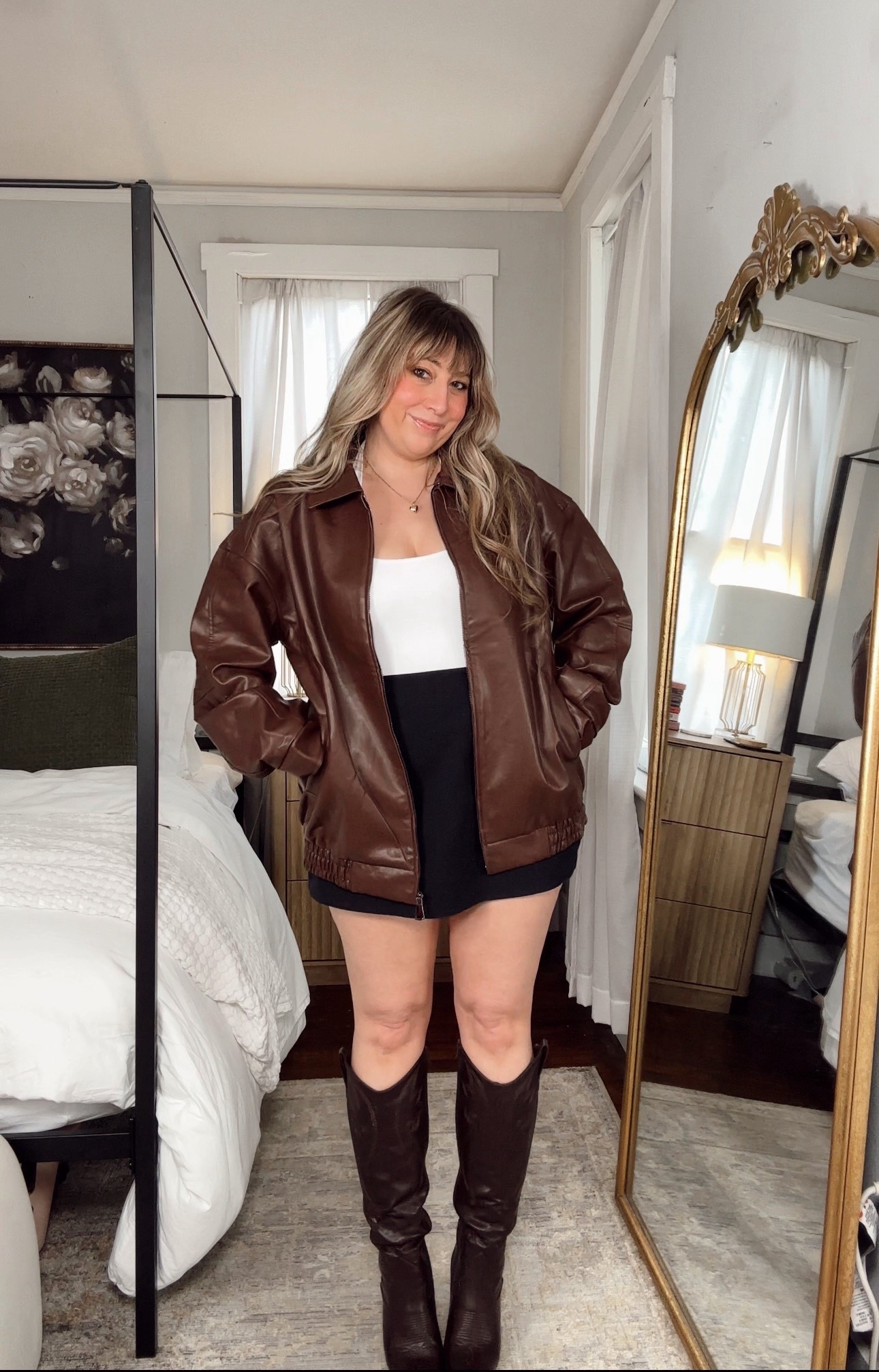 Affordable oversized leather jacket paired with a mini skirt and boots  

#LTKootd #LTKspringtrends