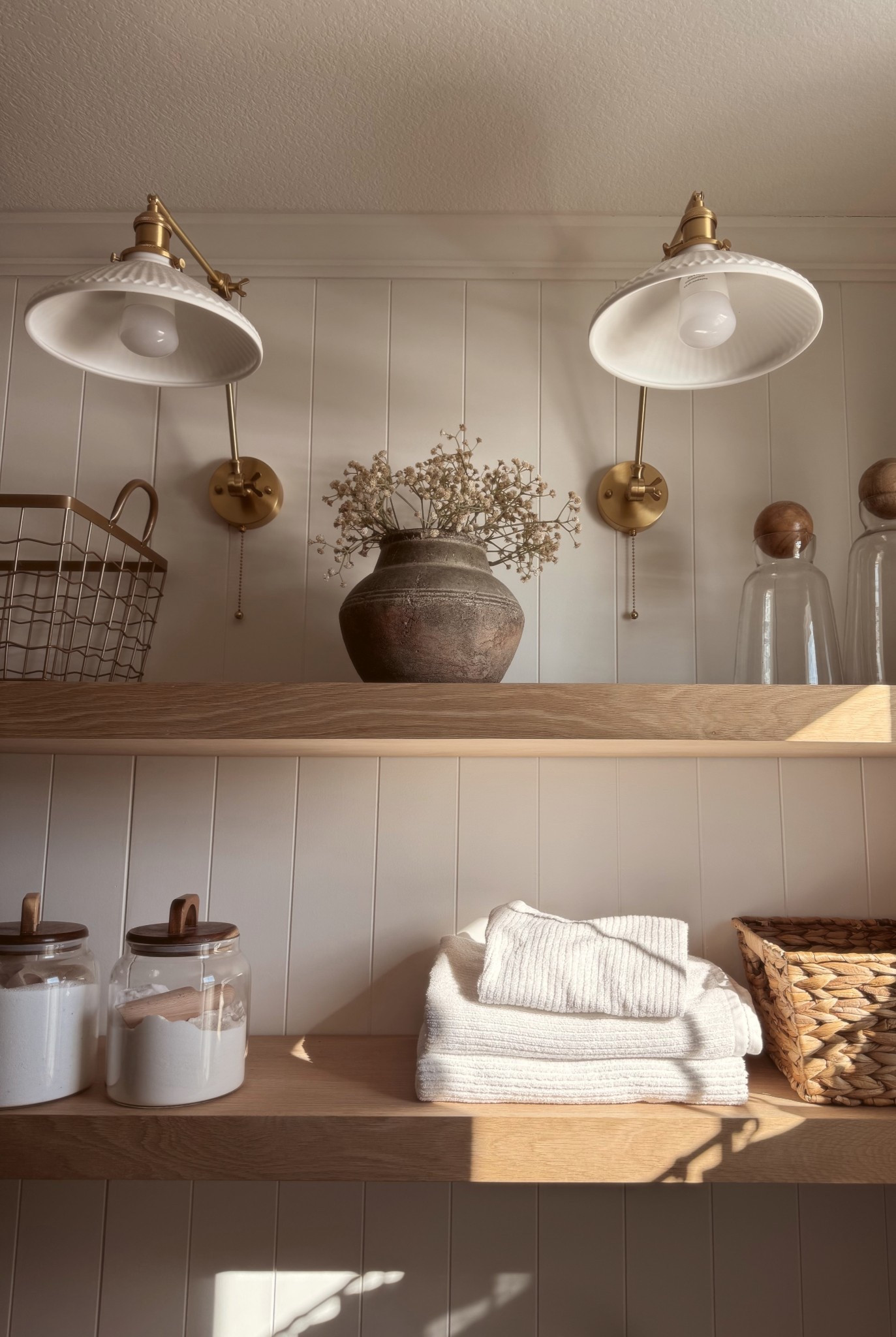 Laundry room diy, wood shelves, oak wood shelves, lighting, sconces, laundry room organizing, home organization, glass jars, best bath towels

#LTKmomlife #LTKHome