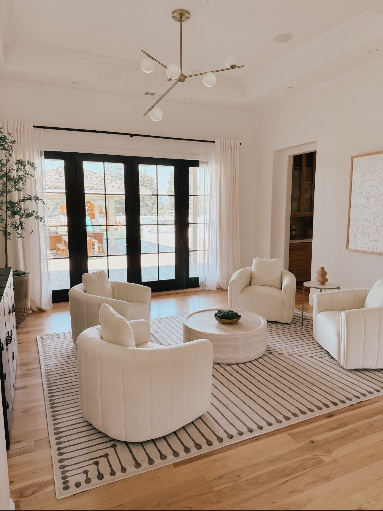 Formal living room with swivel barrel chairs perfect for conversation and gatherings 

#LTKHome