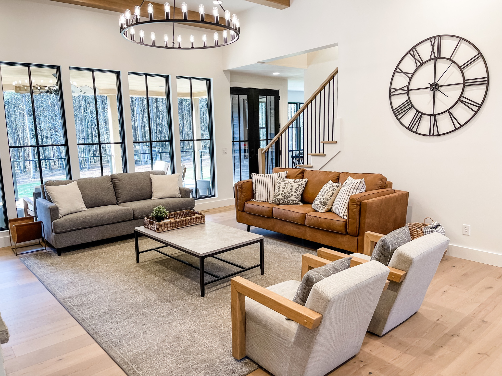 For a designer feel living room make sure to mix and match furniture for a high end feel.  And a large chandelier makes for a great statement piece. 

#LTKstyletip #LTKhome