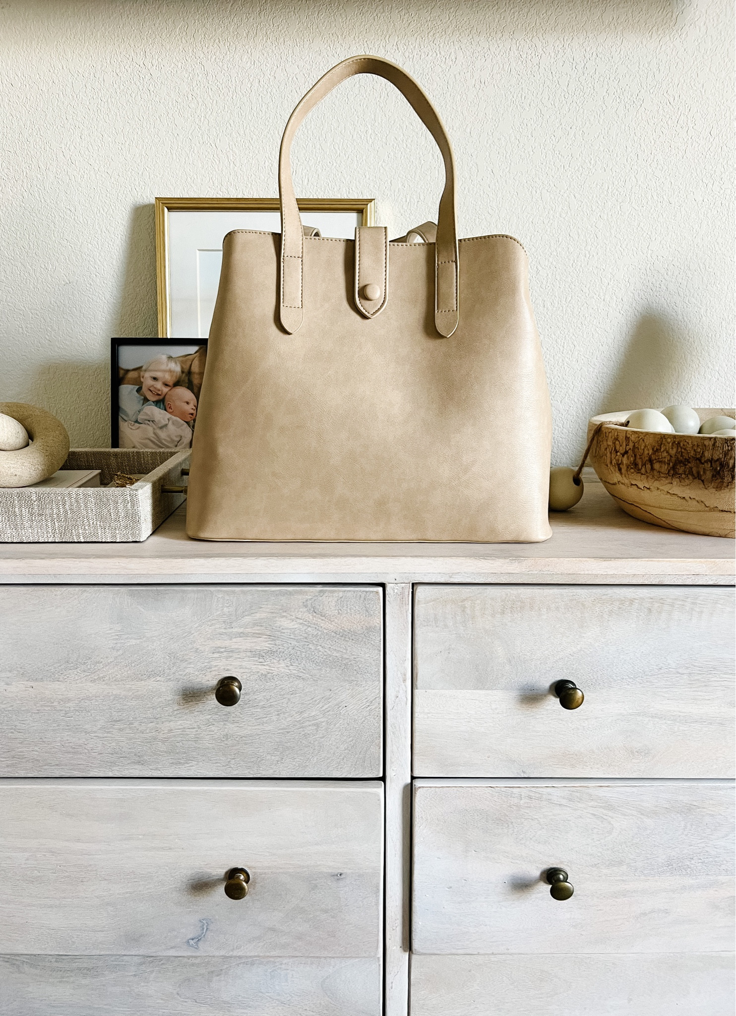 Now, about this @fawndesign diaper satchel y’all. 😍 I really wanted something a bit more elegant and elevated for when I’m out with the kids but don’t want to have on a backpack. This was the answer. It’s so beautiful without the cost of a LV Neverfull. Three sections, multiple compartments, a mini pouch inside and a stroller hook… plus this color and quality 🤌🏻🤯 And did I mention yet that it’s ON SALE + an extra 50% off right now 🫣

If you’ve been around here throughout the years, you know I love my Fawn Design bags. I have two originals, 2 minis, and a circle purse… This is without a doubt my favorite one yet! 🙌🏻 

#LTKfamily #LTKsalealert #LTKitbag