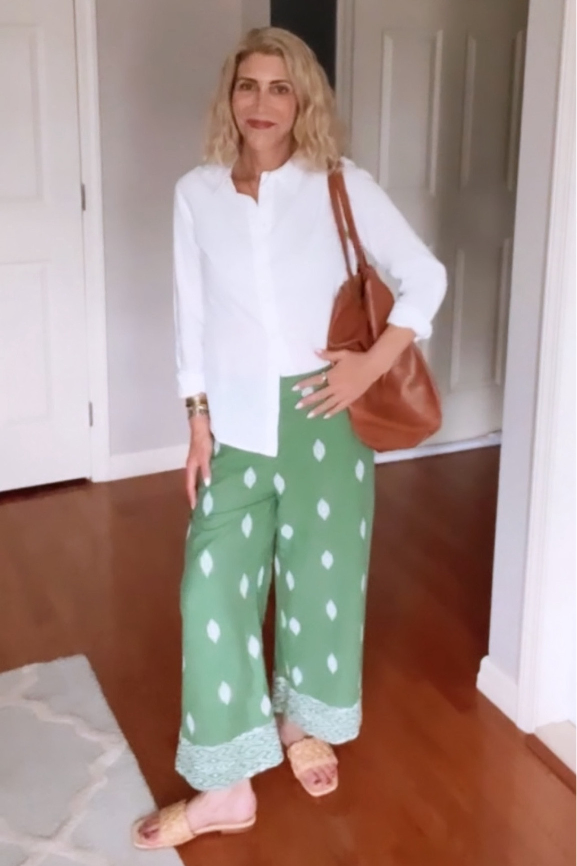 I loved these linen embroidered pants so much I built entire outfit around them. I added a crisp white linen button down and raffia slides. This sumptuous brown leather tote completes the look. 

Runs TTS. I am wearing a size S in both clothing items and a size 9 in the slides for reference. 

#LTKShoeCrush #LTKStyleTip #LTKOver40