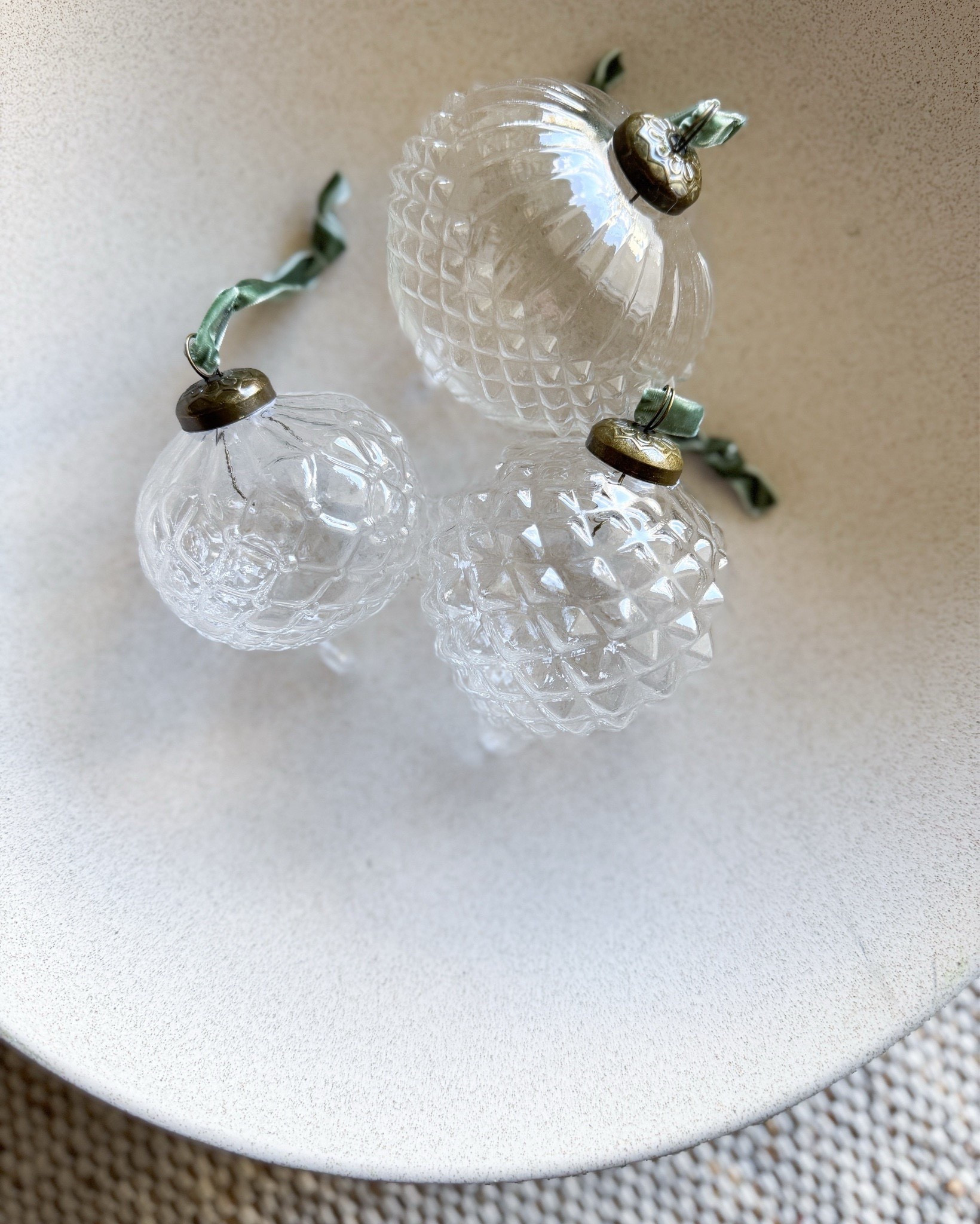 Still one of my favorite ornament finds from last year; these faceted glass ornaments from Target are so simple & timeless. The textured glass and soft brass detail give them that vintage-meets-modern feel that works with any tree or color palette. Perfect for layering with neutrals or adding a little sparkle to a minimal holiday look.

Target glass ornaments - Faceted glass ornaments - Vintage inspired Christmas ornaments - Neutral holiday decor - Minimal Christmas tree styling - Modern holiday ornaments - Textured glass ornament set - Brass detail ornaments - Timeless holiday decor - Target holiday collection - Simple Christmas decorations - Neutral Christmas styling - Modern Christmas inspiration - Minimalist holiday home - Glass ornament ideas - Elegant Christmas ornaments - Classic Christmas decor - Neutral holiday color palette - Target Christmas finds - Affordable holiday decor

#LTKSeasonal #LTKHoliday #LTKHome