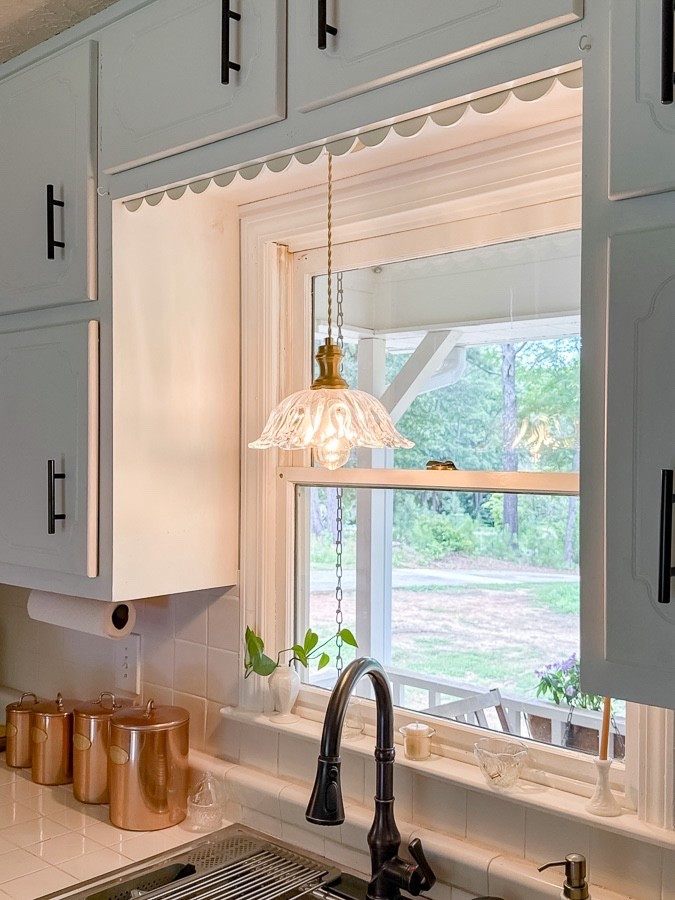 Easy DIY: Add Scallop Trim to Your Cabinets 🪚✨

Want to add instant charm to your kitchen without using power tools? Try this simple scallop trim trick! It’s like adding a little ruffle to your cabinets and it makes the whole space smile.

Supplies: • Scallop trim • Paint + paintbrush • Sandpaper • This hand saw (so easy to use!) • Command strips

Steps:
1. Measure and cut your trim to fit your cabinet.
2. Lightly sand if needed, then paint your trim and let it dry.
3. Stick two command strips together, then remove one backing and press it on the painted side of the trim near the top. I used two sets for longer pieces.
4. Remove the other backing from the strips.
5. Press the trim onto the underside of your cabinet.
6. Repeat for each section.

That’s it! A sweet detail with big impact, no tools, no stress.



#LTKHome