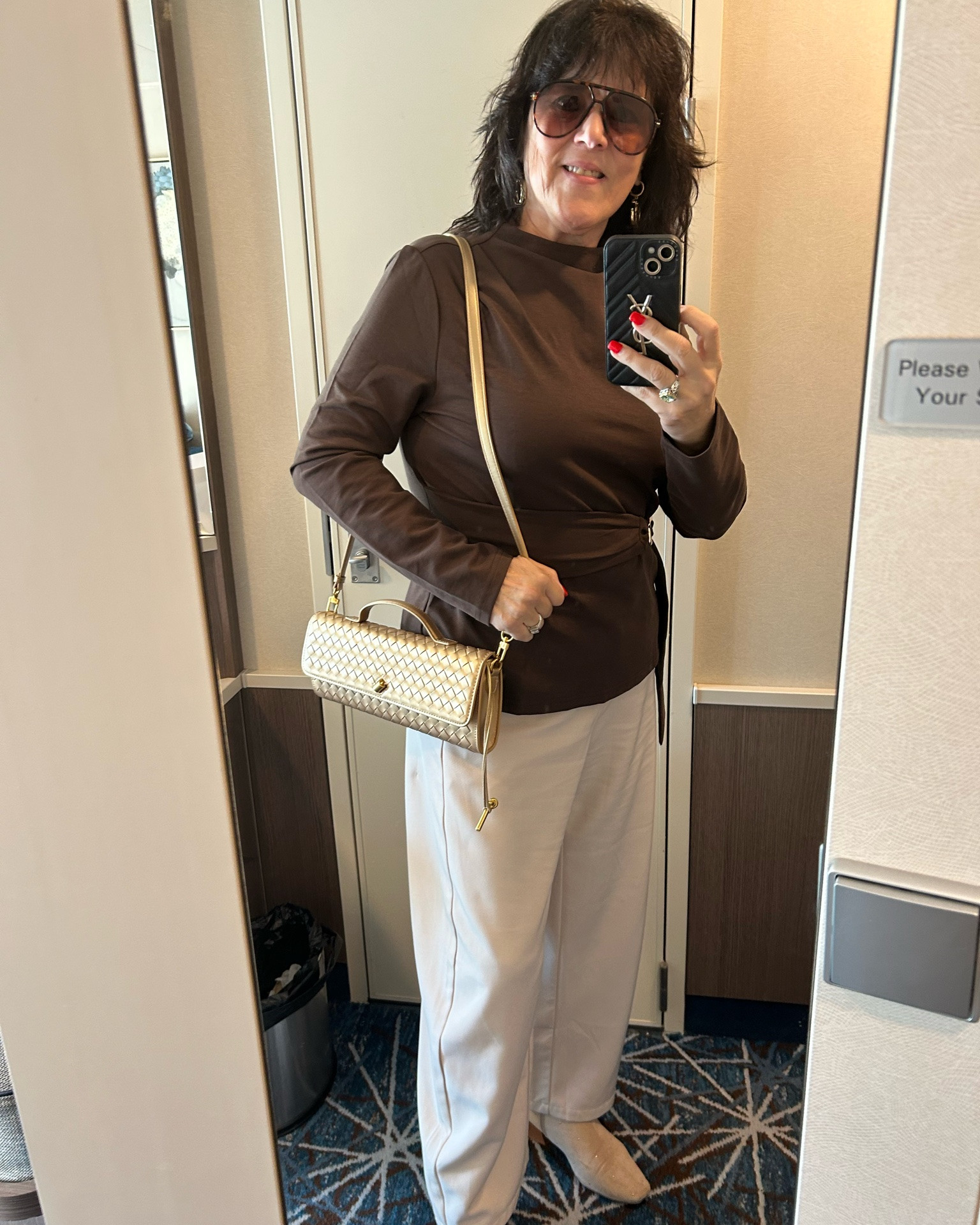 Vacation look loading… cruise or hotel, who can tell 😉💋
This brown + white combo is so classy!! The wide-leg pants and gold clutch just pull it all together. Travel-ready and comfy, that's my kind of style.
Which do you love more — the belt or the sunglasses? Tell me below!!
.
#over50fashion #styleover50 #midlifestyle #agelessfashion #vacationstyle Love this top for the Fall! It runs true to size and comes in so many colors. Love the belt accent. I am wearing a large.

#LTKTravel #LTKvlog #LTKootd