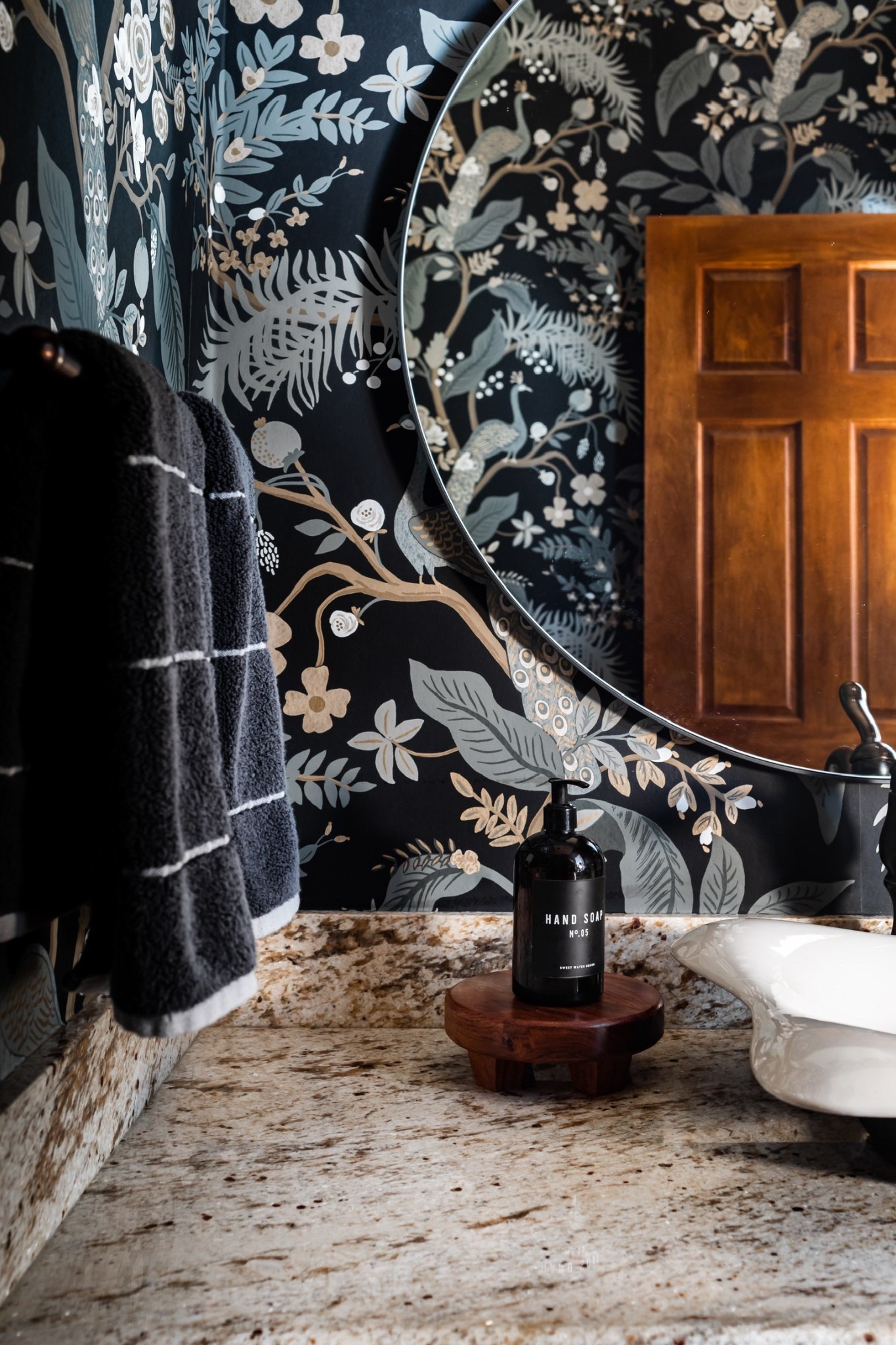 This Rifle Paper Co. peacock wallpaper is the perfect selection for a moody powder bath. I then paired with a round black wall mirror, to ensure to wallpaper was the star ⭐️ of the show. 

#LTKdayinmylife #LTKHome