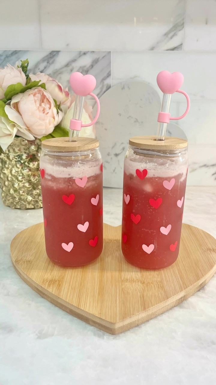 Making a gut-friendly dirty soda. Cherry vanilla Ollipop, a mixture of coconut milk and sweetened condensed coconut milk 1:1, squeeze a lime wedge in each of them, and stir. Find these cute heart glasses with lids and heart cutting board below. Perfect for Valentines or Galentines, both kids and adults can enjoy this drink!