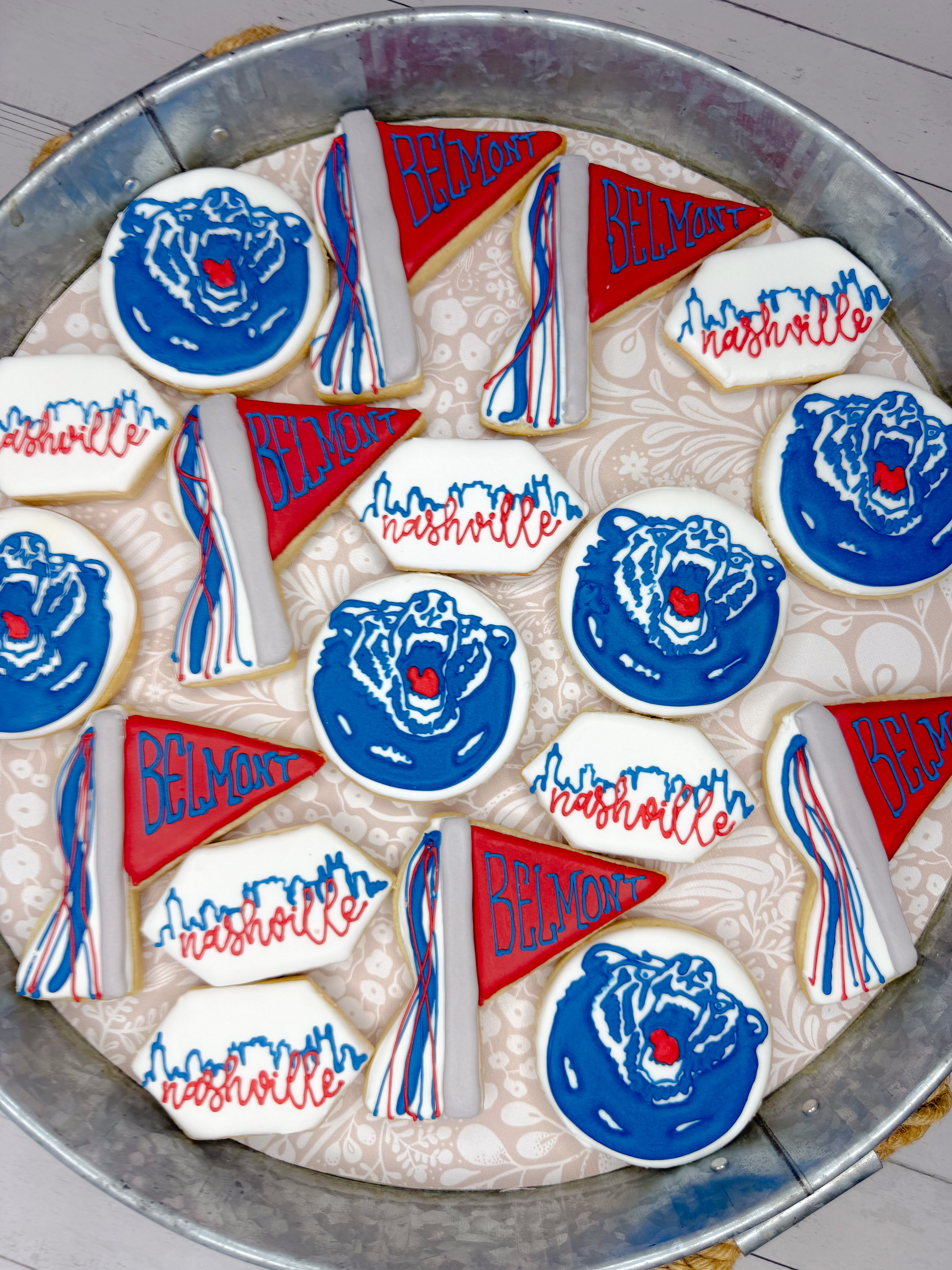 Celebrating Belmont University with custom decorated sugar cookies inspired by Nashville! 💙❤️ These hand-decorated royal icing cookies are perfect for college celebrations, graduation parties, alumni events, game days, tailgates, and personalized dessert tables. The sweetest way to celebrate your favorite school! 

 #CustomCookies #DecoratedCookies #SugarCookies #RoyalIcing #CookieArtist #BelmontUniversity #BelmontBruins #Nashville #NashvilleTN #CollegeCookies #GraduationParty #CollegeGraduation #TailgateParty #GameDayTreats #DessertTable #CustomDesserts #PartyInspiration #BakeryLife #CookieDecorating #PersonalizedCookies #LTKdayinmylife #LTKfoodie #LTKU