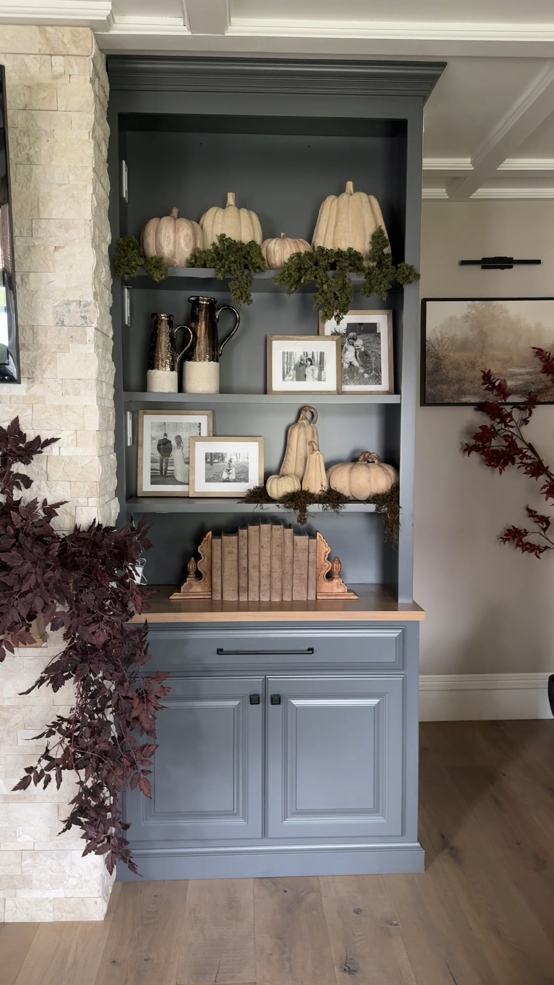 Elevated my shelf decor for $20 with these dark moss stems and extra Spanish moss I had from another project! Perfect fall finishing touches!

Neutral Pumpkins | Fall Mantle Garland | Wood Grain Pumpkins | Fall Decorating

#LTKSeasonal #LTKHome