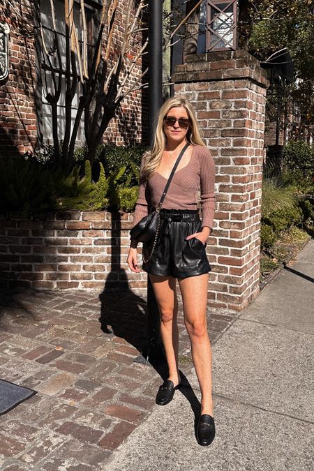 Easy Fall outfit styling faux leather shorts. Wearing a small in the wrap sweater. Shows run a tad long, but I didn’t size down. I prefer the way they fit, and they are comfortable enough to walk around town in! 

#LTKunder100 #LTKunder50 #LTKshoecrush