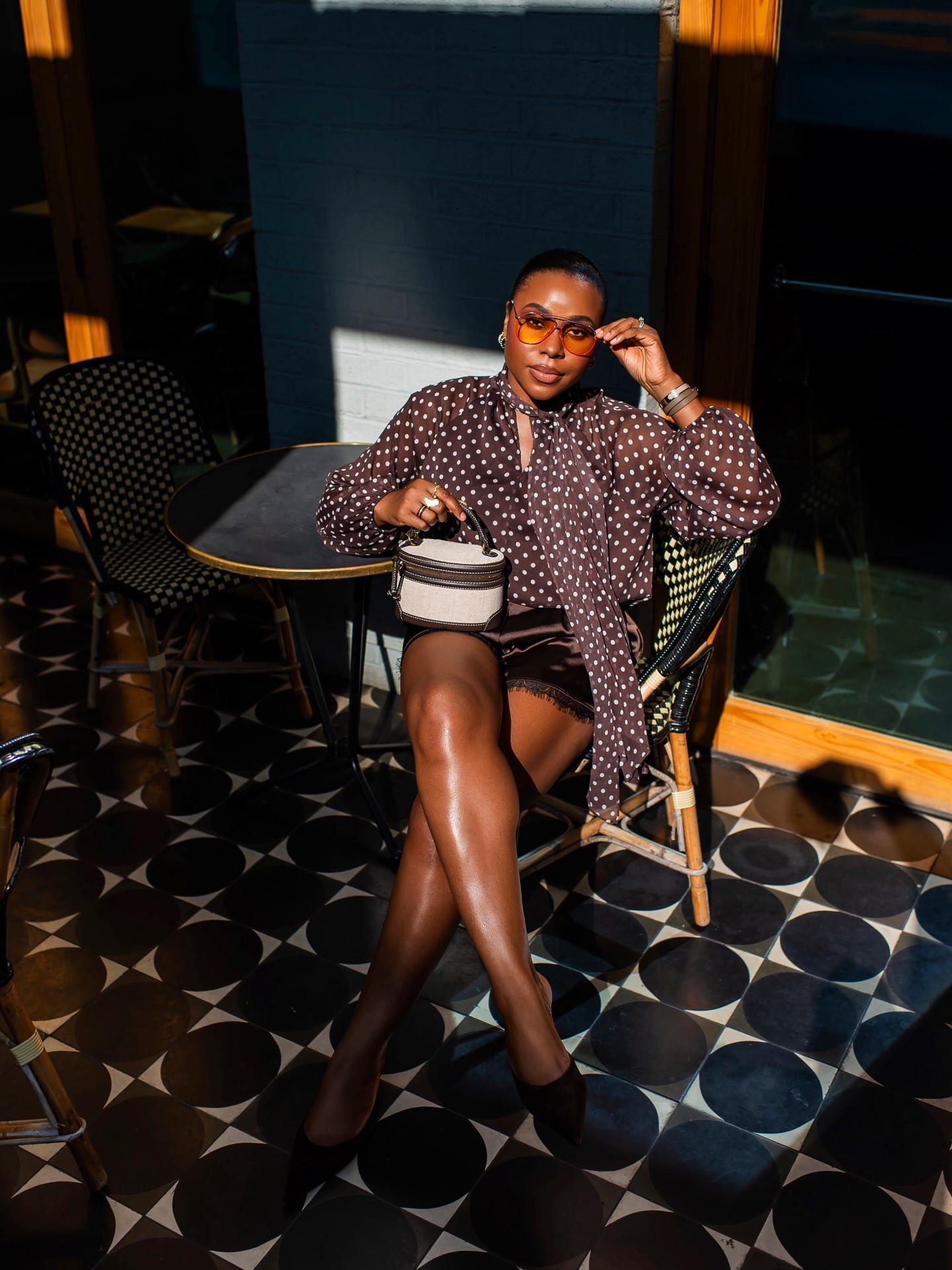 Sometimes photos really capture the mood 💯 

My polkadot blouse, lace trim shorts & mules are all under $50 finds. Comment brown 🤎 for direct links or see my profile. 

Fave aviators by @tribal.eyes 
Brought out my super old LV Speedy 35 (purchased 19yrs ago) it’s a perfect daytime/travel bag.

Spring fashion, polka dots, atlanta creator, #springfashion #monochromatic