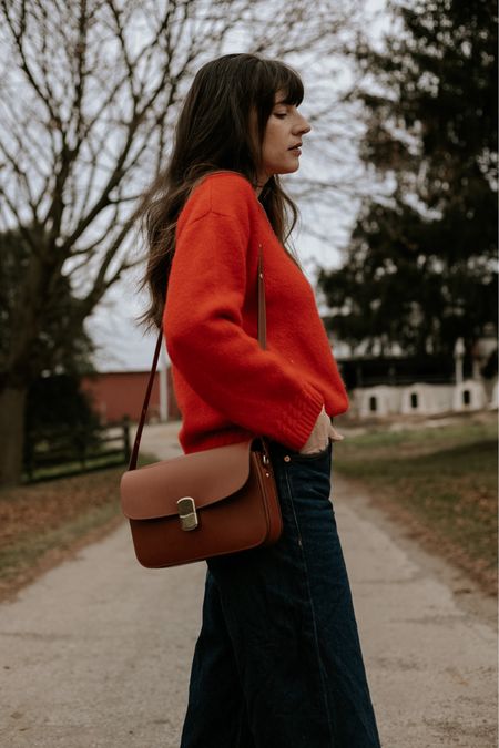 Classic crossbody bag from #sezane with red sweater and dark baggy jeans. Leather handbag  

#LTKitbag