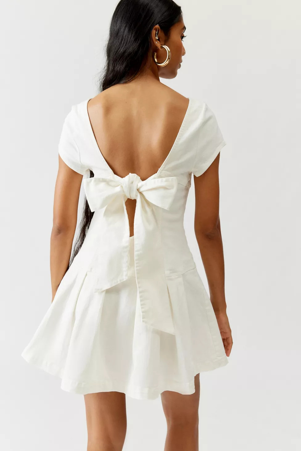 UO Bryan Bow-Back Pleated Mini Dress | Urban Outfitters (US and RoW)