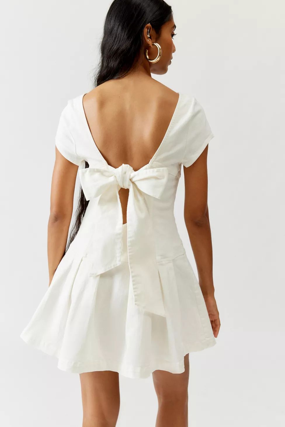 UO Bryan Bow-Back Pleated Mini Dress | Urban Outfitters (US and RoW)