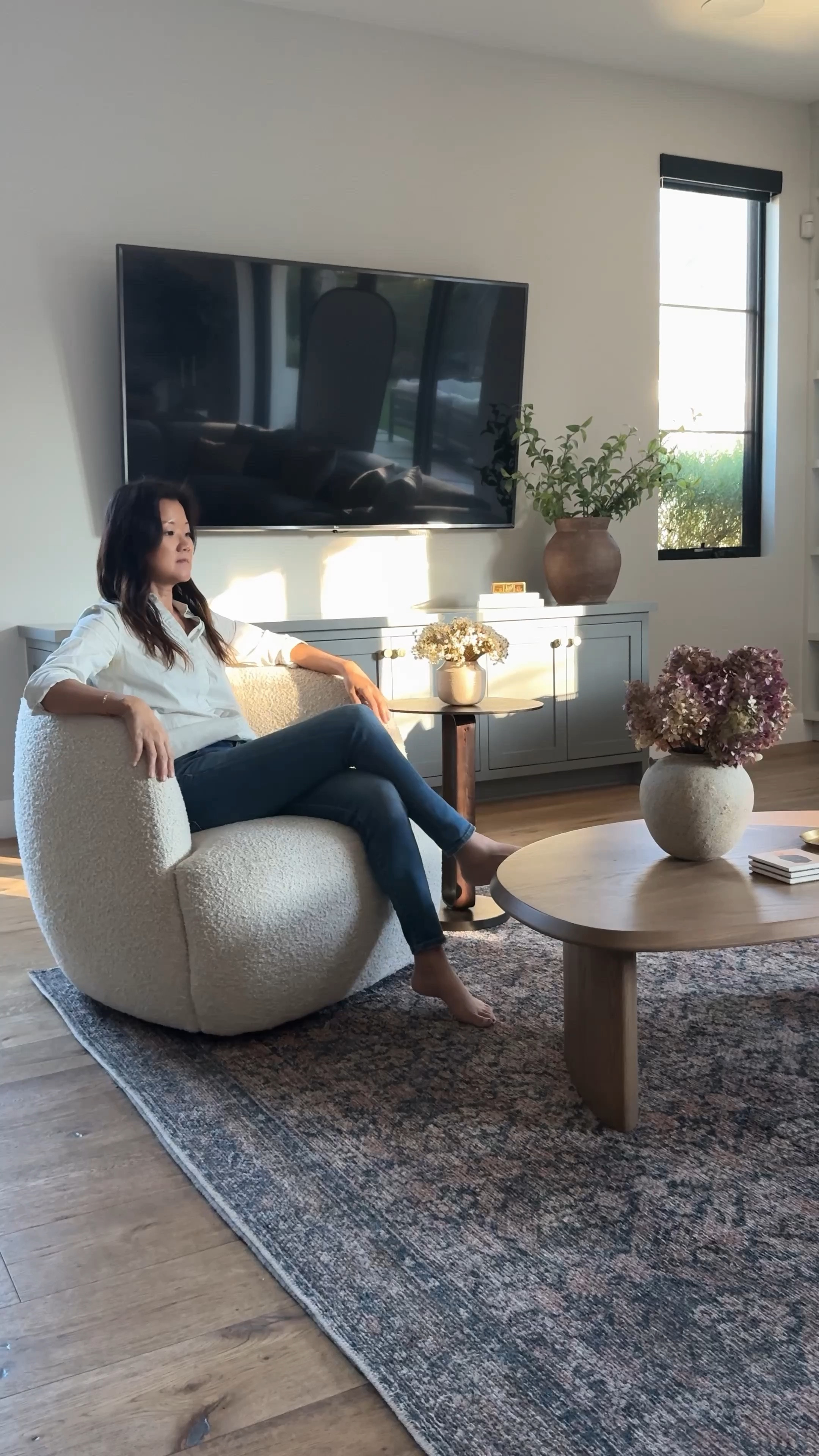 Living room decor, grey motion, sectional sofa black side table, swivel chair, poster, white chair, wood, coffee, table, and table, dried flowers, vase, hydrangeas, vintage rug, Loloi Kathy kuo Walmart Wayfair cb2 white chair Arhaus brown vase mcgee eucalyptus branches 

#LTKfindsunder50 #LTKhome #LTKsalealert