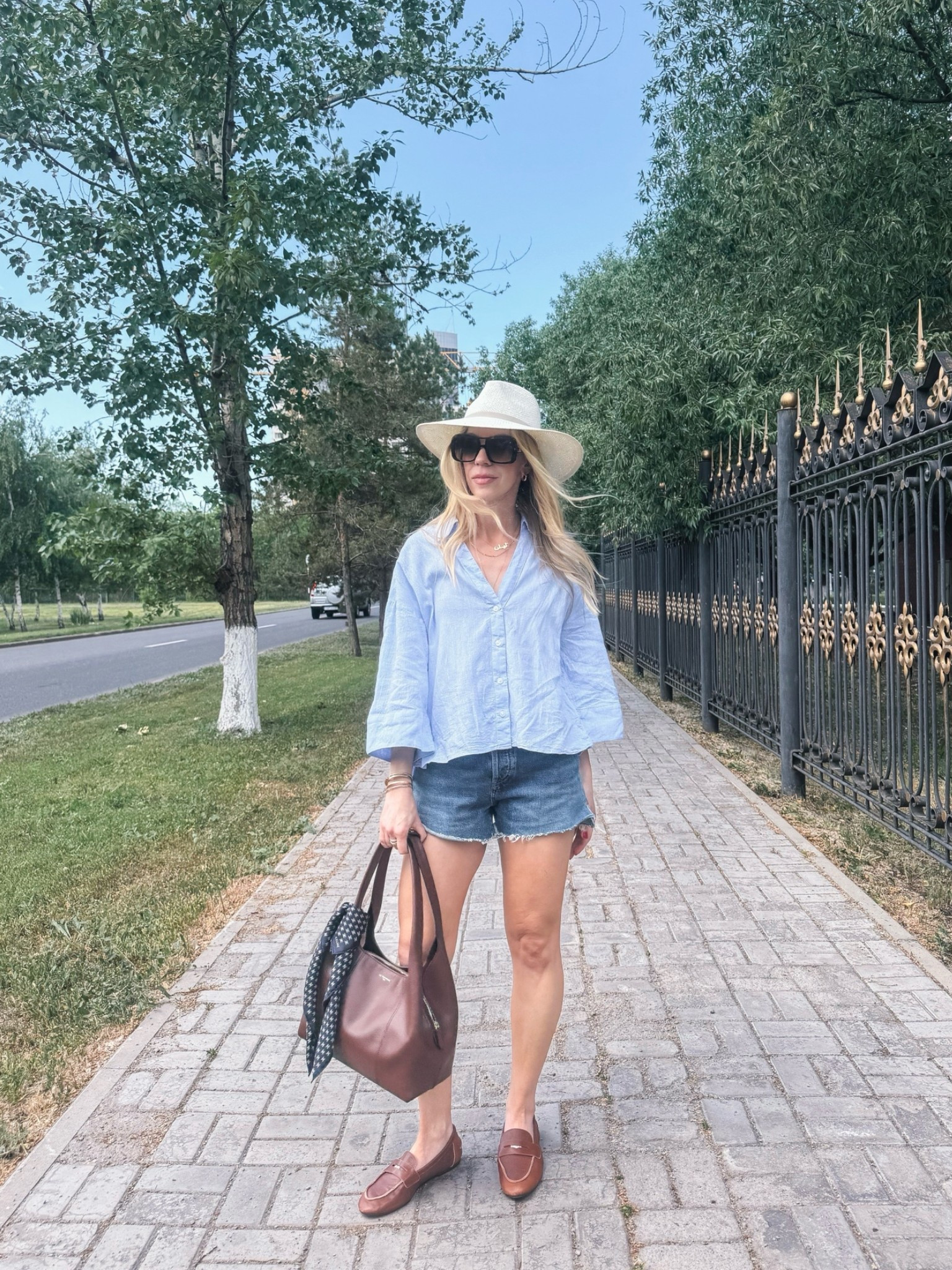 Casual summer outfit with @Janessa Leone white straw hat, blue linen shirt, denim cutoff shorts, @Zara leather loafers (on sale now)

#LTKSaleAlert #LTKTravel #LTKSeasonal