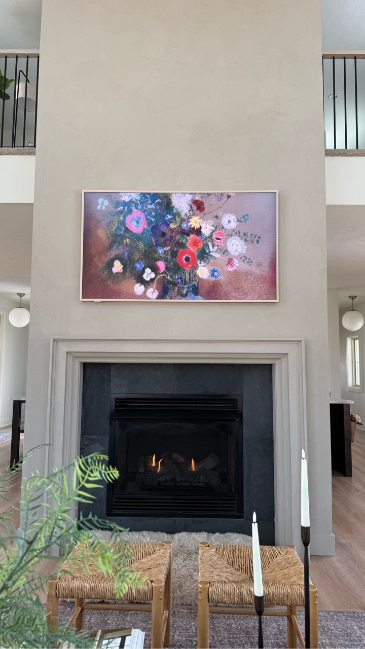 The fireplace is finally finished!  We applied Roman Clay in the color Charleston from @portolapaints.  It changed the whole room so much.  It was easy to apply and the color and texture made this space!  Reveal of the back side of the double side fireplace tomorrow.

Comment SHOP for a link to the Roman Clay we applied.

#homedecorating #twostoryfireplace #romanclay #livingroomfireplace #fireplacemakeover

#LTKHome