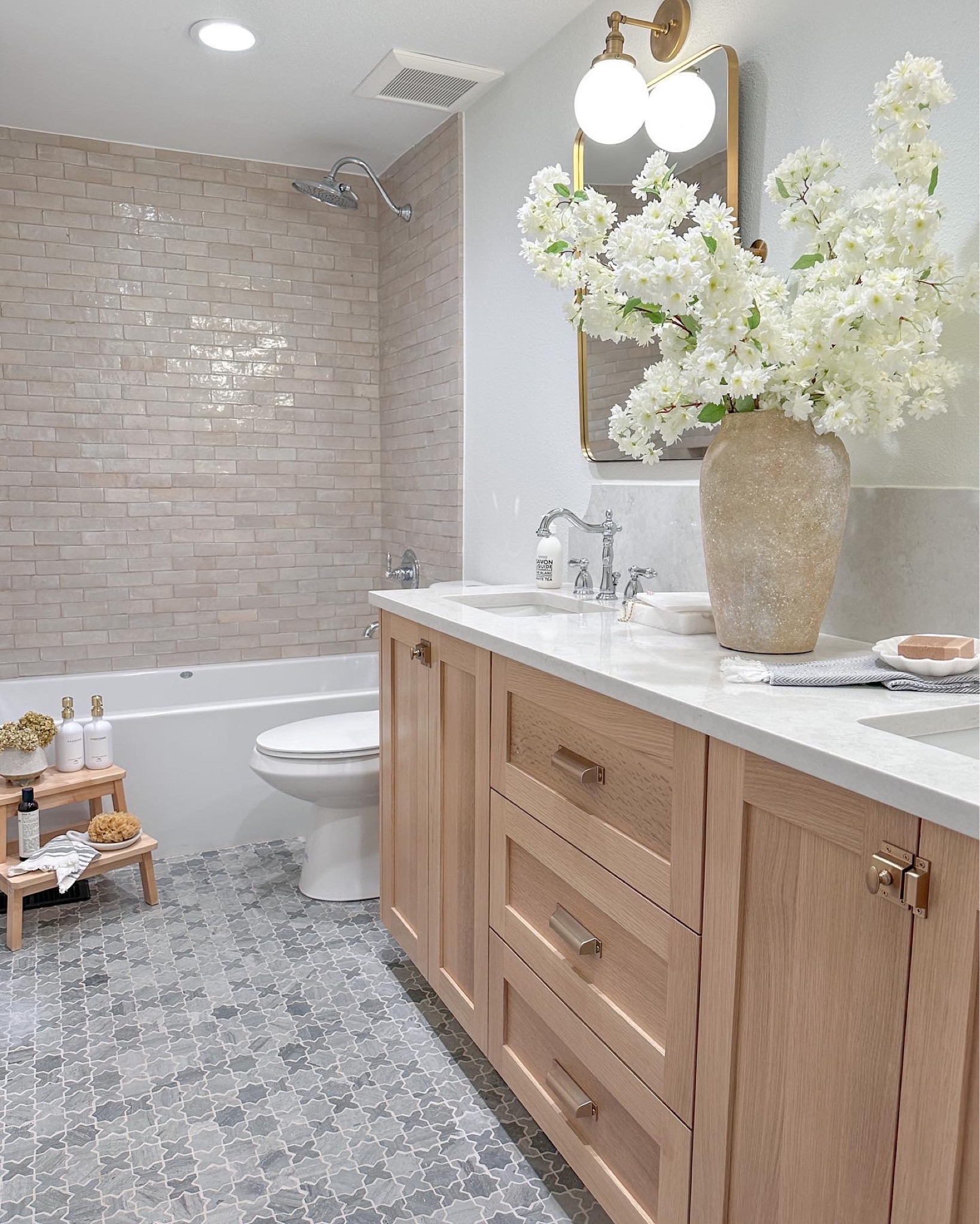 Shop our bathroom remodel! I’m love with how all of these elements came together to make one serene spa like bathroom! 

Guest bathroom /zellige tile /marble bathroom/spring florals /white oak vanity /bathroom goals 

#LTKhome #LTKstyletip #LTKunder100