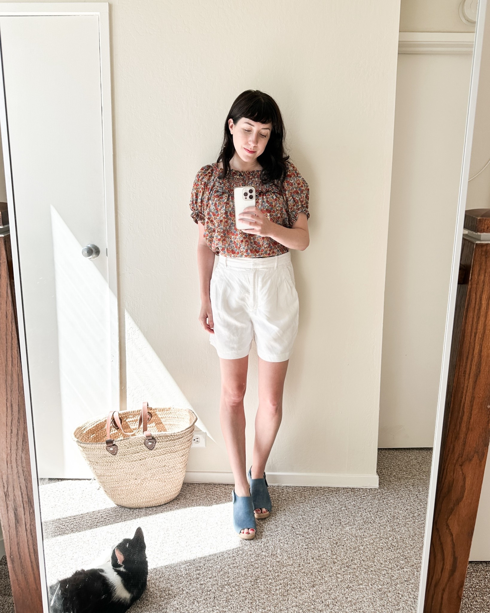 Doen floral blouse paired with Aritizia shorts and Bryr clogs 