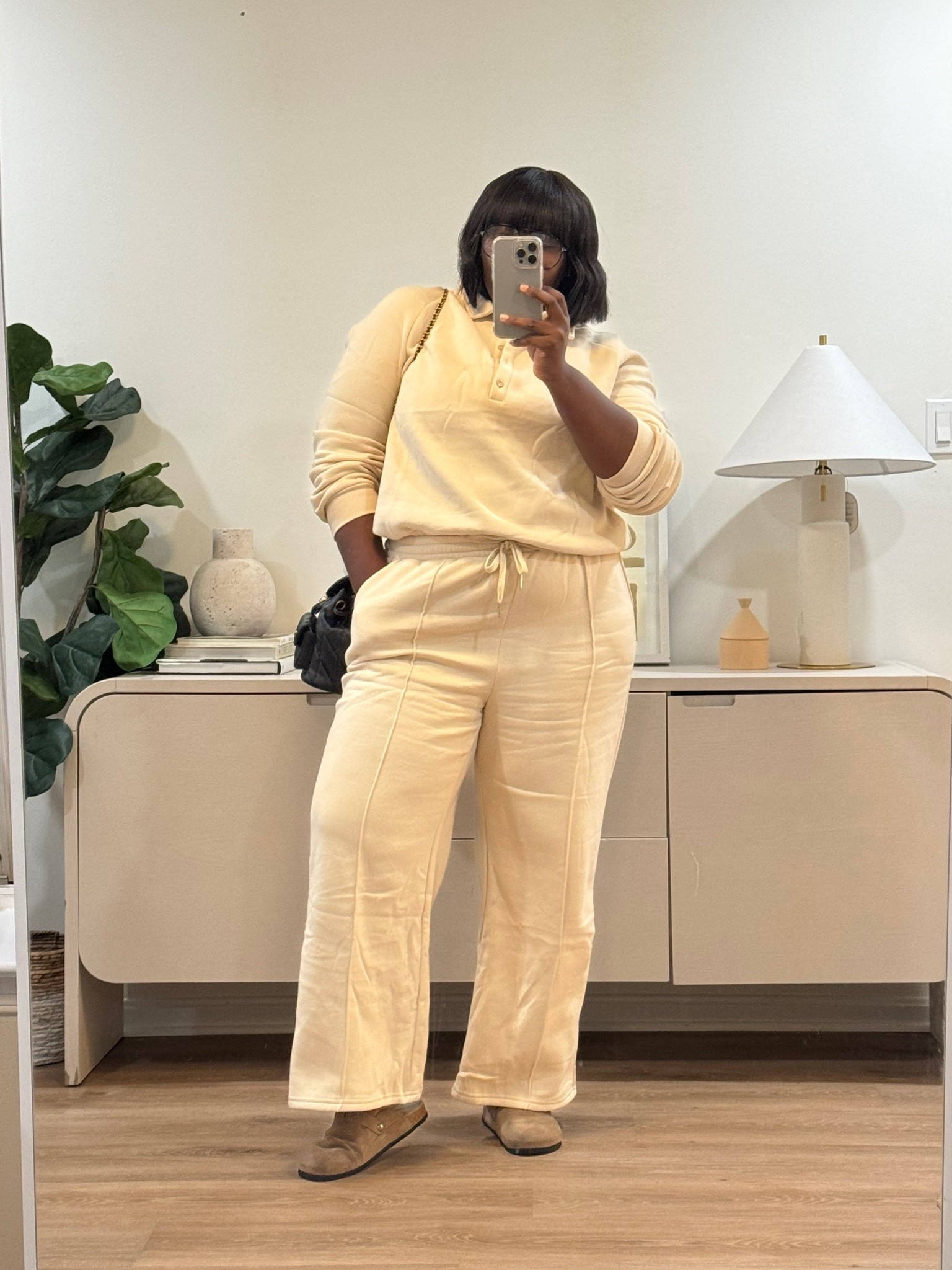 Long travel days are a good reason to reach for a comfortable matching set. The relaxed top, drawstring waistband, and wide-leg pants offer a laid-back look without the hassle of coordinating separate pieces. cream matching lounge set, women's two-piece sweat set, wide-leg sweatpants outfit, cozy fall outfits, neutral loungewear, casual chic outfit, plus-size casual fashion, airport outfit women, matching lounge set outfit, fall Amazon fashion finds. @amazonfindsandfashion @coach @Wayfair