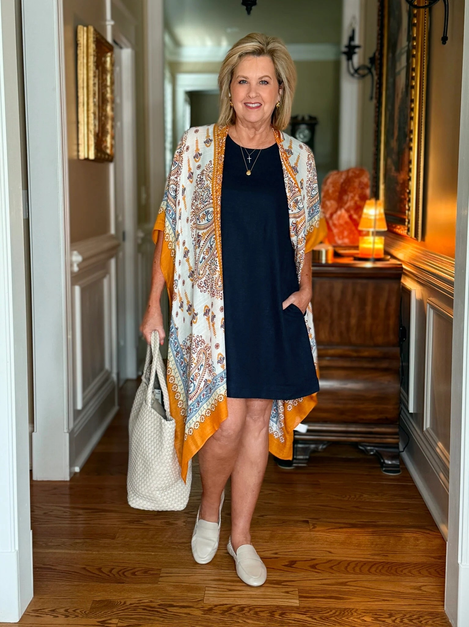 I’m wearing the same linen dress in a large, but I’ve added different accessories. A colorful kimono, simple loafers and a matching tote bag give the dress a different feel.