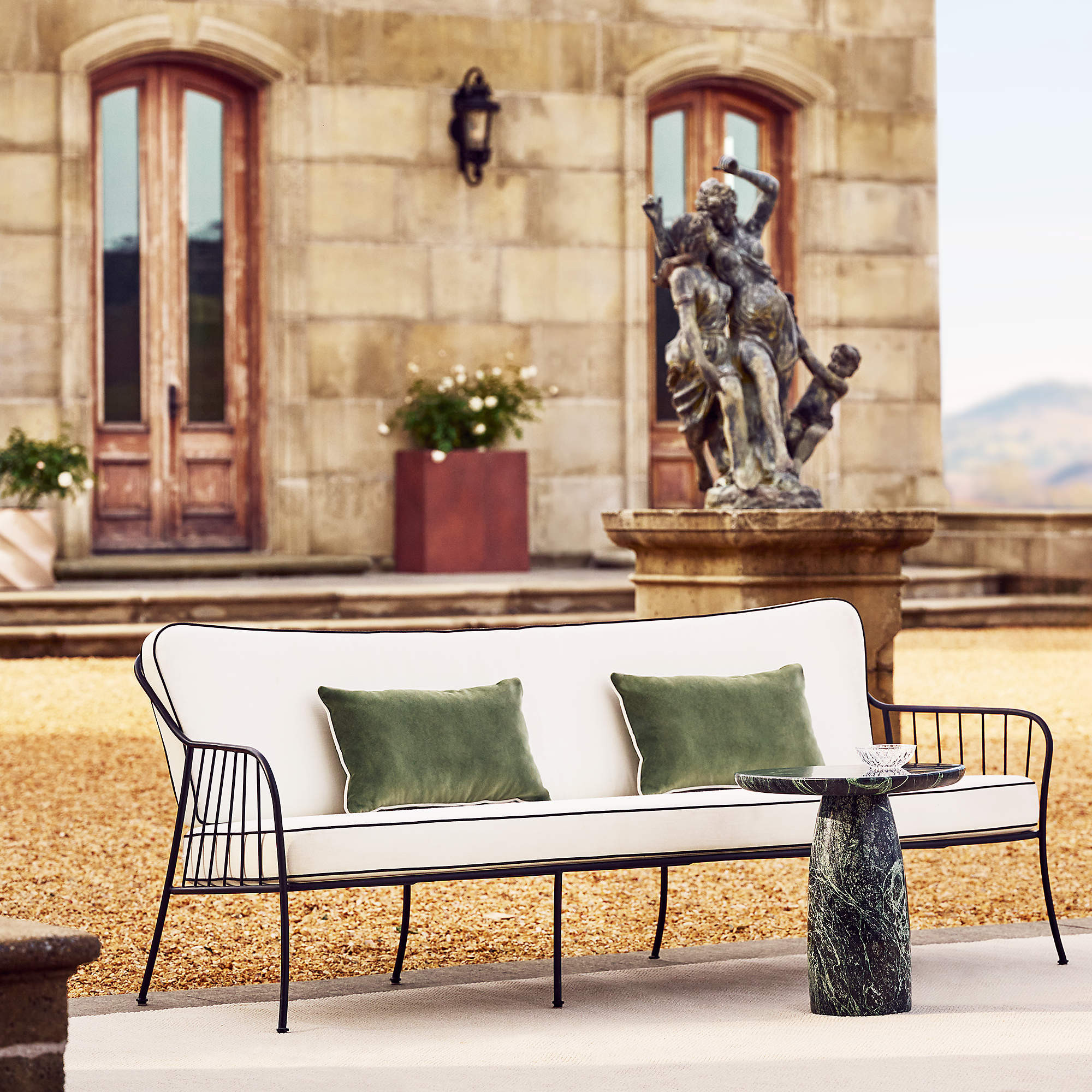 Welling Black Metal Outdoor Sofa with Green Sunbrella Cushions | CB2 | CB2