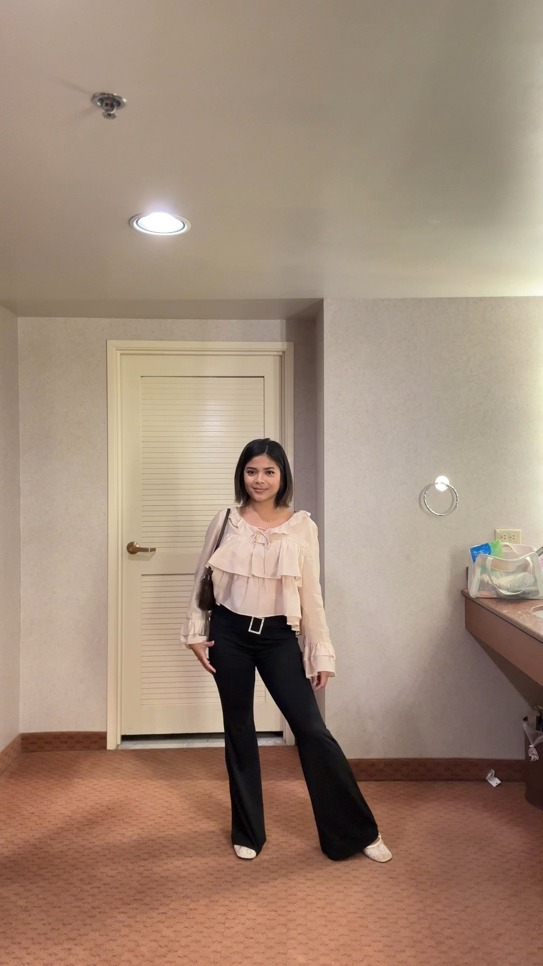Currently obsessed with the coquette aesthetic mixed with classic staples. I paired this sheer ruffled top with black bell bottom pants for a chic minimalist outfit. This is the perfect transition outfit for 2026. Follow for more affordable luxury style and shop the look below!

#RuffleBlouse #FlarePants #BusinessCasual #OOTD #SpringFashion

#LTKootd #LTKWorkwear #LTKFindsUnder50