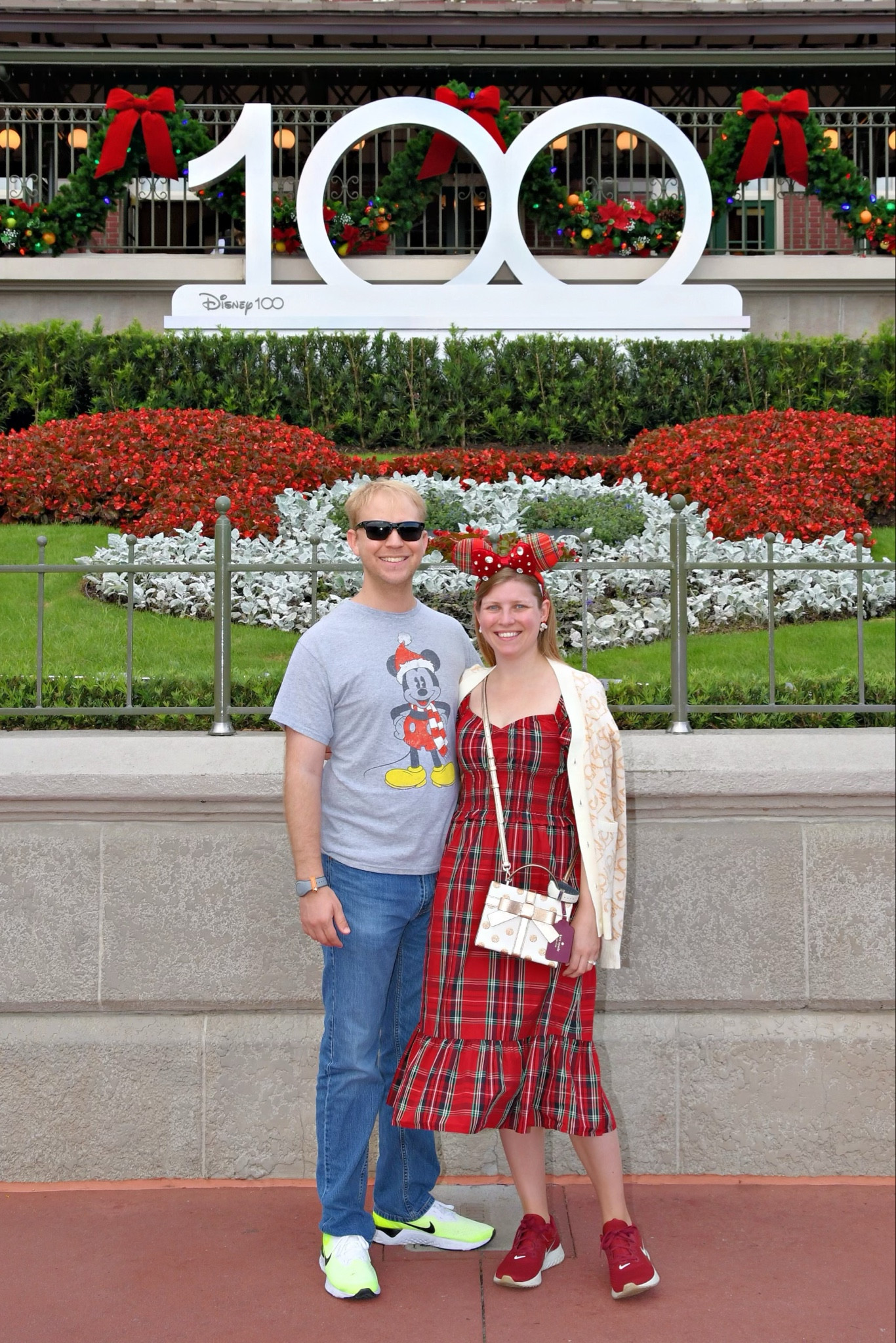 Holiday Christmas Disney outfit. Tartan dress with plaid ears, and Mickey Santa earrings 