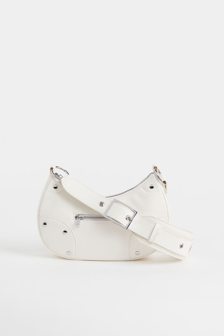 Small bag in faux leather with studs. Adjustable shoulder strap with metal buckle, zipper at top,... | H&M (US + CA)