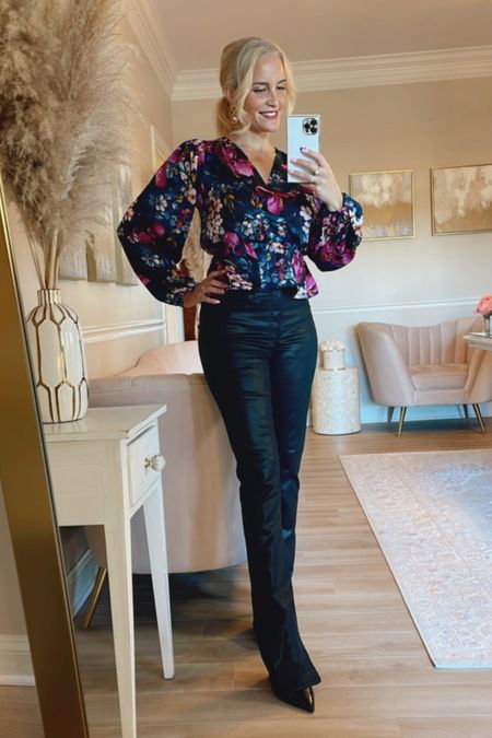 A pretty floral top with black coated jeans and black patent mules.

#LTKstyletip #LTKHoliday #LTKSeasonal