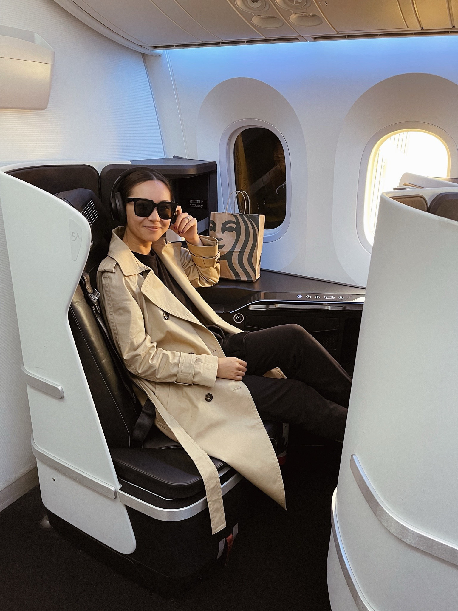 Airport outfit / long haul international flight outfit 

Trench coat 
Leggings with lockers 
Noise cancellation headphones 
Celine sunglasses 